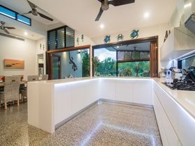 Tranquility by the Lake Luxury Port Douglas Accommodation tropical living kitchen