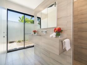 Tranquility by the Lake Luxury Port Douglas Accommodation bathroom garden view