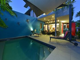 Esplanade Villa Luxury Holiday Accommodation Port Douglas beachfront pool at dusk